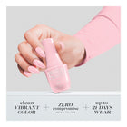 Hand holding bottle
